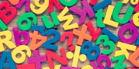 Colourful letters scattered on a table.