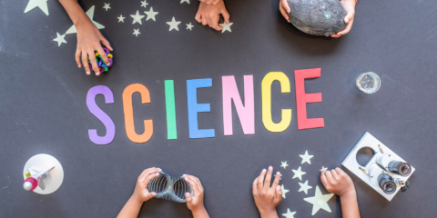 The word "Science" spelt out in colourful letters on a table.