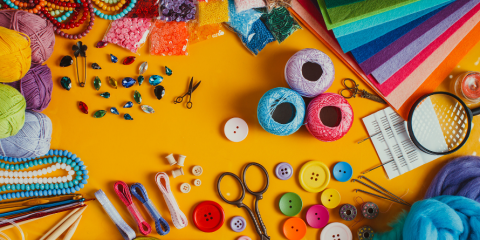 Art supplies are scattered on a table.