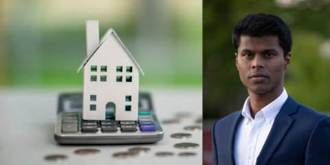 Half of the image is as white paper house on a grey calculator. coins surround the calculator. The right half of the image is a man wearing a blue suit with white shirt