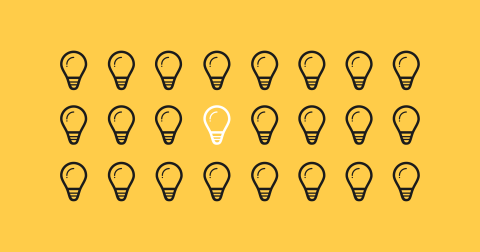 Three lines of black lightbulb graphic art on a yellow background. One lightbulb graphic in the centre is white to illustrate a big idea amongst many ideas.