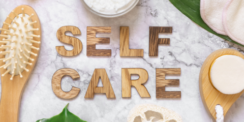 Self care products spread out on a table.