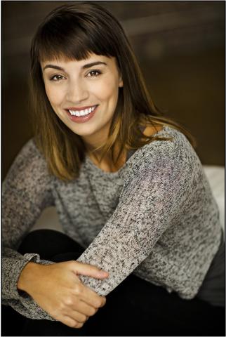 Woman posing for a picture with arms crossed