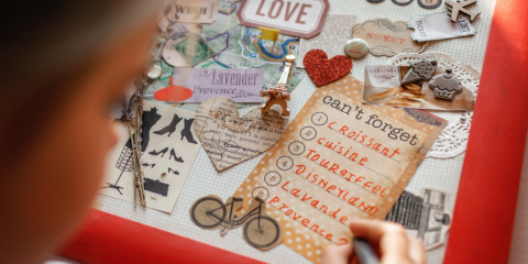 Person working on a collage mood board. 