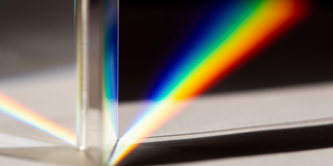 A picture of a rainbow on a glass prism 