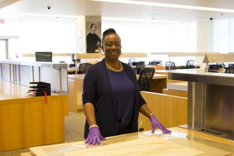 Dr Natasha Henry-Dixon standing at a table