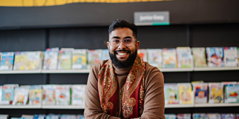 Person standing up and crossing arms