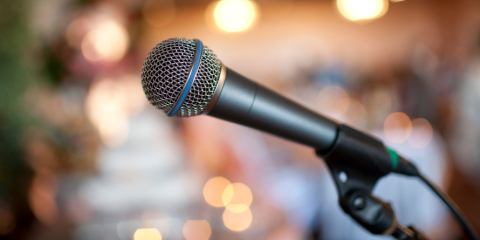 Microphone on stand, blurred background. 
