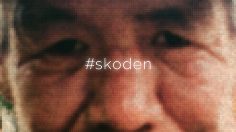 A close up of Pernell Bad Arm's face with the words "#skoden" written across the middle.