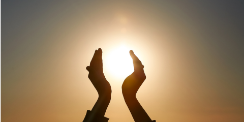 Sun clasped in hands