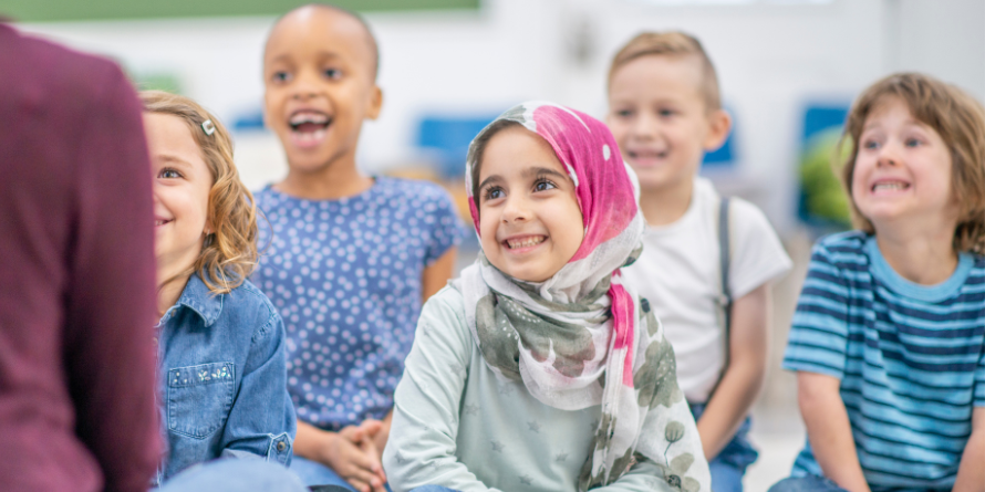 Children listening to someone reading them a book.