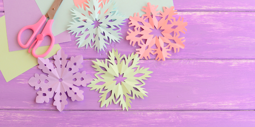 Paper snowflakes on a table.