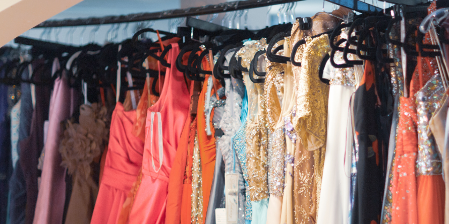 A clothing rack of dresses.