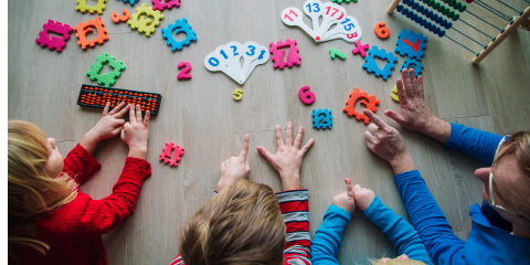 Children engaged in math activities.