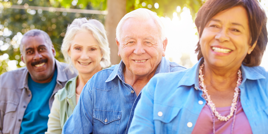 Four smiling seniors.