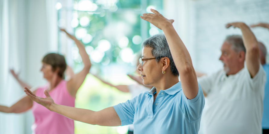 Group of seniors performing Tai Chi. 