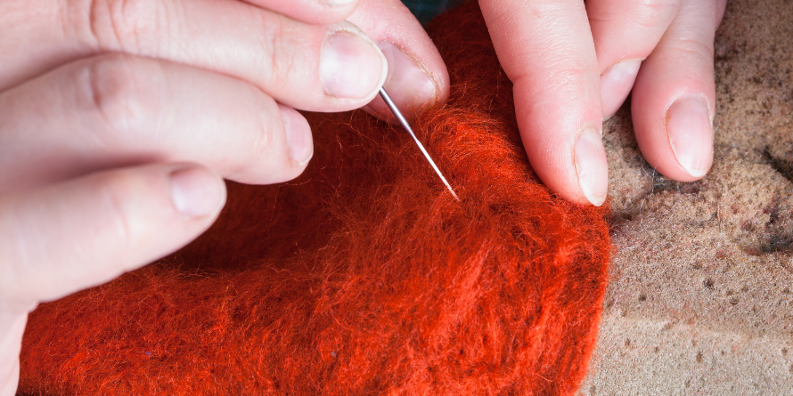 Close-up, hands felting.