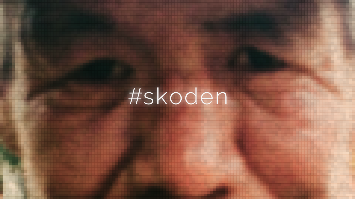 A close up of Pernell Bad Arm's face with the words "#skoden" written across the middle.